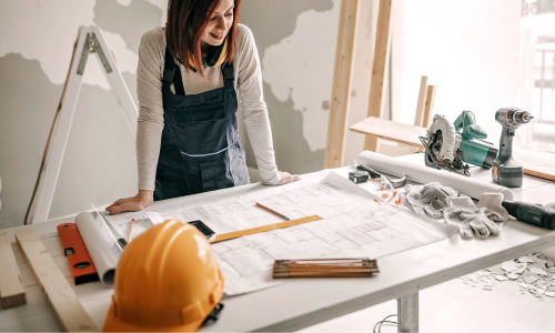 Contractor looking at blueprints